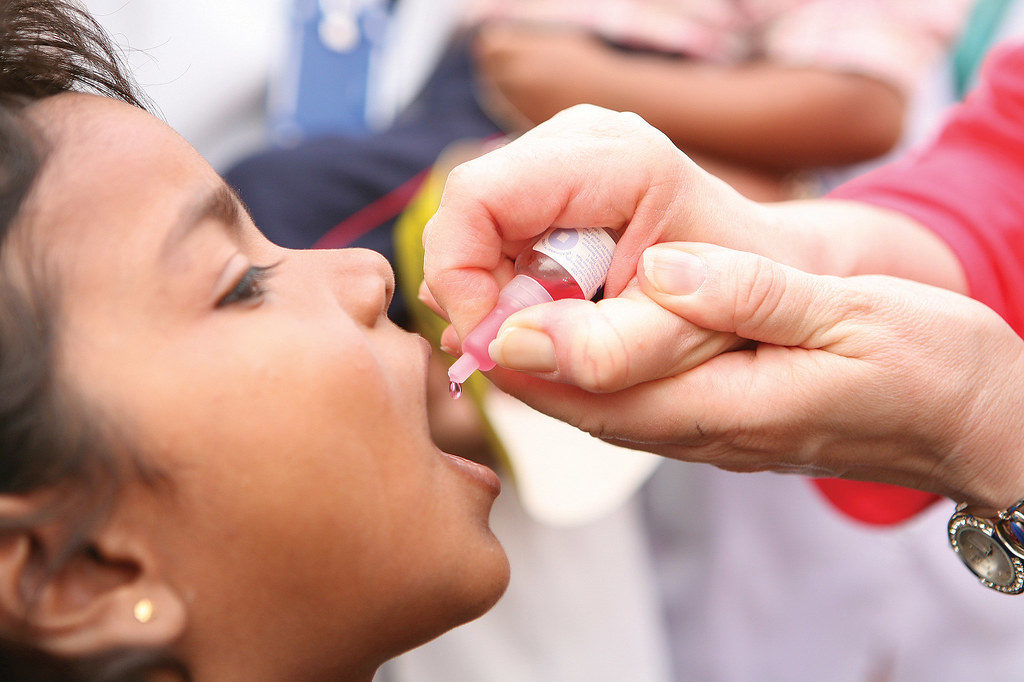 Image of child getting oral polio vaccine