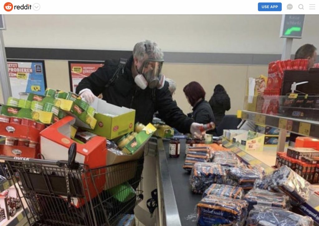 Guy in gas mask buying groceries